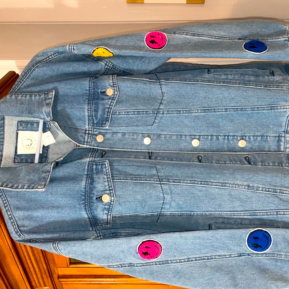 Smiley face blue Jean jacket. Size small but fits medium/large. Nwt